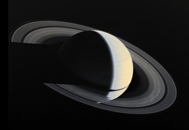 PIA00335: Full-disk Color Image of Crescent Saturn with Rings and Ring Shadows