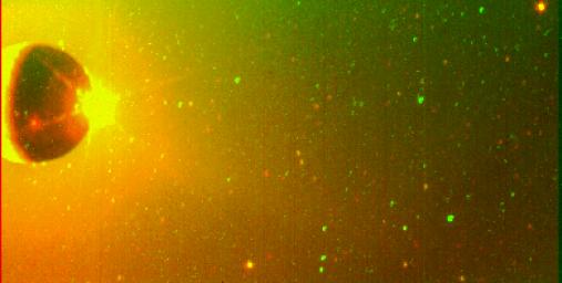 PIA01111: Io's Sodium Cloud On-Chip Format (Clear and Green-Yellow Filters Superimposed)
