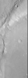 PIA01445: Eroded Crater Adjacent to Huygens Impact Basin