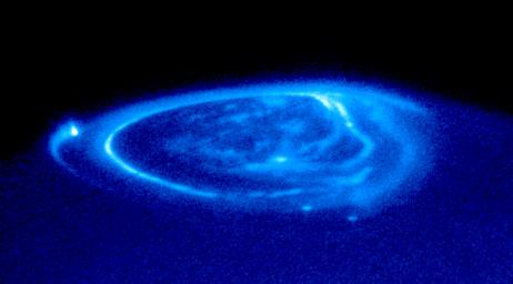 PIA03155: Satellite Footprints Seen in Jupiter Aurora