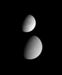 PIA07621: Tethys Meets Dione
