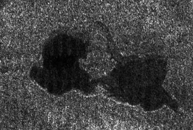 PIA08740: Titan's "Kissing Lakes"