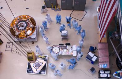 PIA09206: Team Huddle Before Lifting Phoenix into Test Chamber