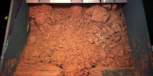 PIA10745: Martian Soil Inside Phoenix's Robotic Arm Scoop