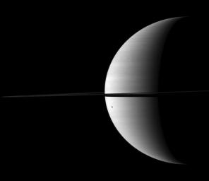PIA12526: Dione's Distorted Shadow