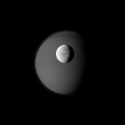 PIA12659: Dione and Ghostly Titan