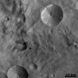 PIA14953: Dark Areas in Cratered Terrain on Vesta