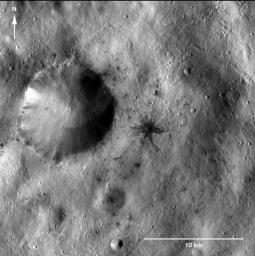 PIA15239: Dark-Rayed Crater and Spots
