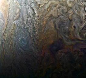 PIA21386: Dark Spot and Jovian 'Galaxy'