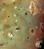 PIA00328: Io, Showing Volcanic Plains and Mountains