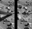 PIA00528: 'Mister Badger' Pushing Mars Rock