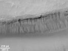 PIA01032: Evidence for Recent Liquid Water on Mars:"Weeping" Layer in Gorgonum Chaos