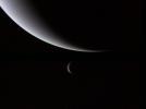 PIA02215: Crescents of Neptune and Triton