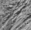 PIA02582: Stair-step Scarps in Dark Terrain on Ganymede
