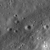 PIA12950: Riccioli Crater: Cracked, Melted, and Draped