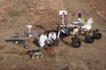 PIA15280: Three Generations of Rovers with Crouching Engineers