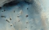 PIA17908: A Dark-Toned, Pitted Mound in a Crater in Northeast Arabia Terra