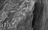 PIA18830: Mounds of Layered Material on the West Edge of Melas Chasma