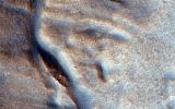 PIA19861: A Fresh Shallow Valley Transitions to an Inverted Channel