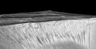 PIA19917: Dark, Recurring Streaks on Walls of Garni Crater