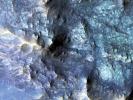 PIA21205: Exposed Fractured Bedrock in the Central Pit of a Crater