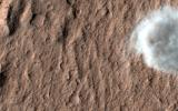PIA21457: A Dust Devil on Hilly Terrain