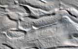 PIA21556: Icy Flow in a Crater
