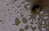 PIA21636: A South Polar Pit or an Impact Crater?