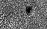 PIA23759: A Crater Enlarged by the Sublimation of Ice