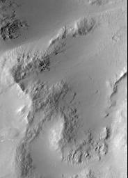 PIA02306: A Typical Martian Scene: Boulders and Slopes in a Crater in Aeolis